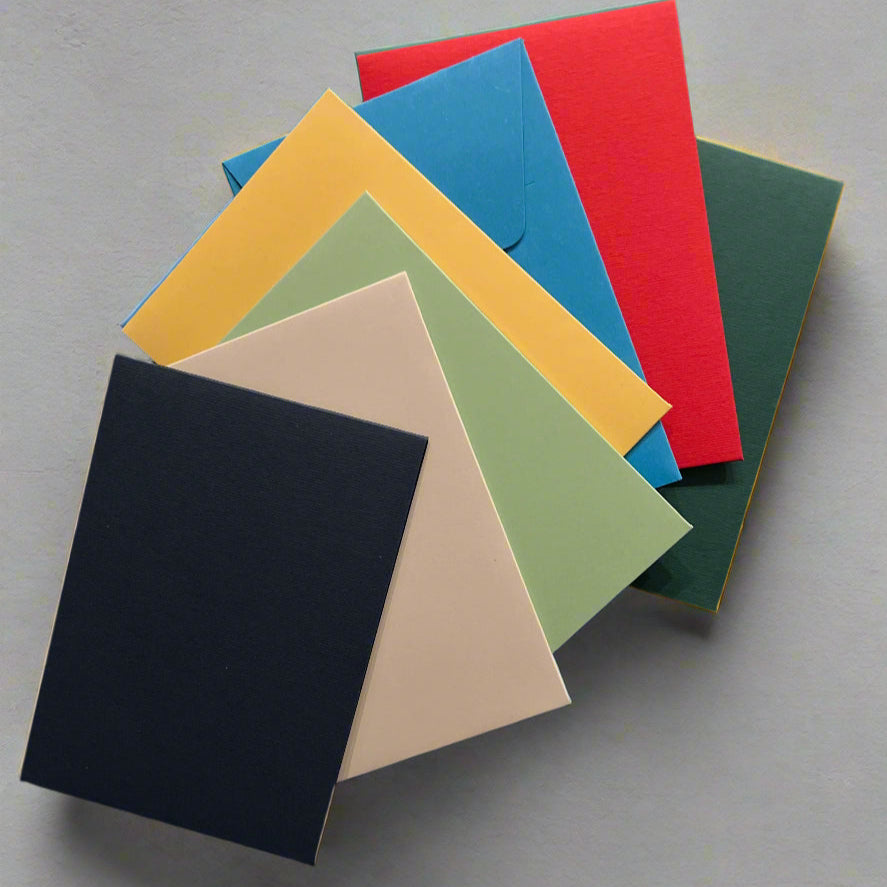 A collection of colorful pouch envelopes in various colors including blue, green, yellow, pink, red, and black.
